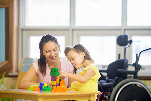 Child in wheelchair receiving specialized care and developmental activities - American Allied Health Columbia SC